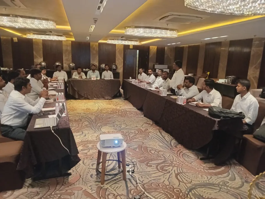Sales team meet in a hotel conference hall