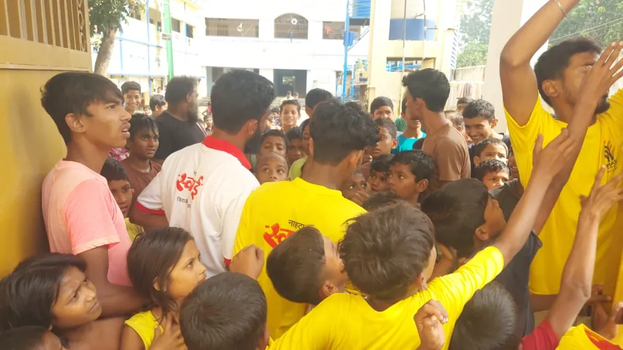 Children reaching for sample packs